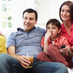 Hispanic-family-watching-TV